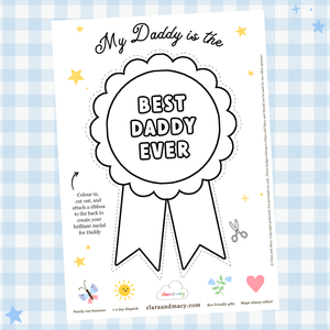A colouring sheet of a 'Best Daddy Ever' medal is shown on a blue gingham background.