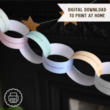 Finished Daddy Is Amazing paper chain garland hanging across a fireplace mantel, filled with handwritten Father's Day memories, compliments and messages from children.