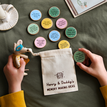 Child holding personalised Daddy & Me memory making ideas bag with wooden activity tokens for Father’s Day gift.